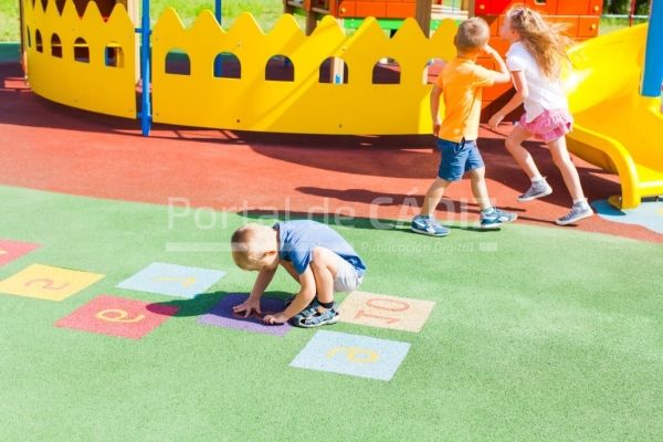 boy playing alone at the playground summer day t20 0dlnz9