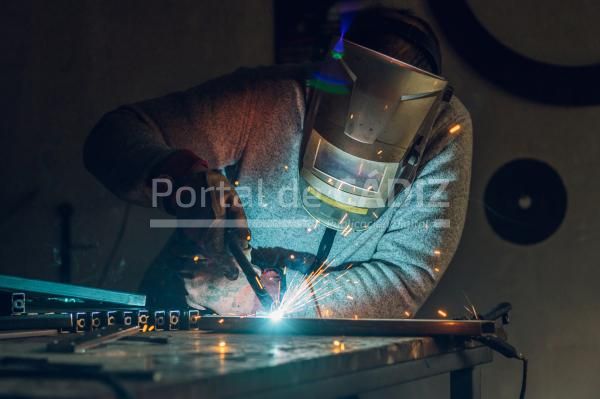 man worker welding metal with welding machine in a 2022 11 24 20 42 16 utc