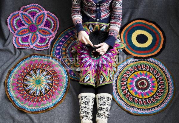 neck down view of woman sitting on floor crochetin 2022 03 04 01 42 38 utc