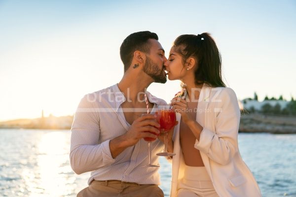 loving ethnic couple kissing on seafront 2022 01 18 23 54 47 utc