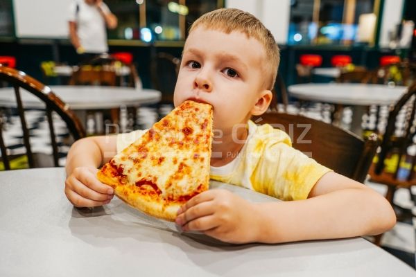 child eats pizza in cafe close up 2022 11 17 00 15 27 utc