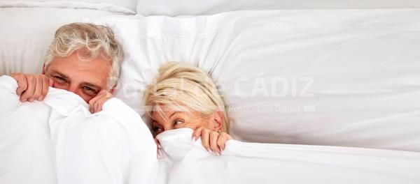 senior couple hiding and smile in bed for fun co 2023 10 07 03 09 50 utc