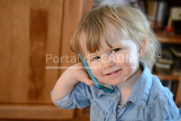 smiling little girl toddler child talking on a cel 2022 11 14 03 48 28 utc