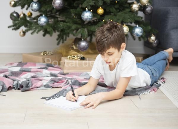 boy writes letters to santa claus near the christm 2021 12 09 20 11 18 utc