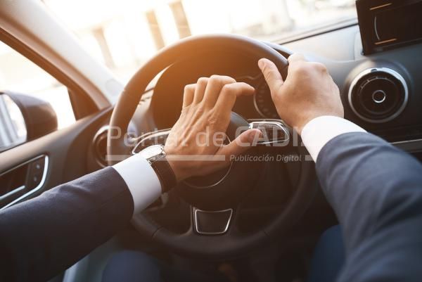 close up of a man driving a car with a hand on a h 2022 01 31 06 11 32 utc