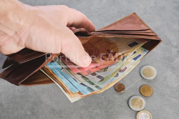 senior man holds a wallet with euro banknotes in h 2022 09 21 15 56 10 utc 1